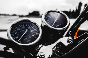 Mission Statement Image with motorcycle from gauge perspective.